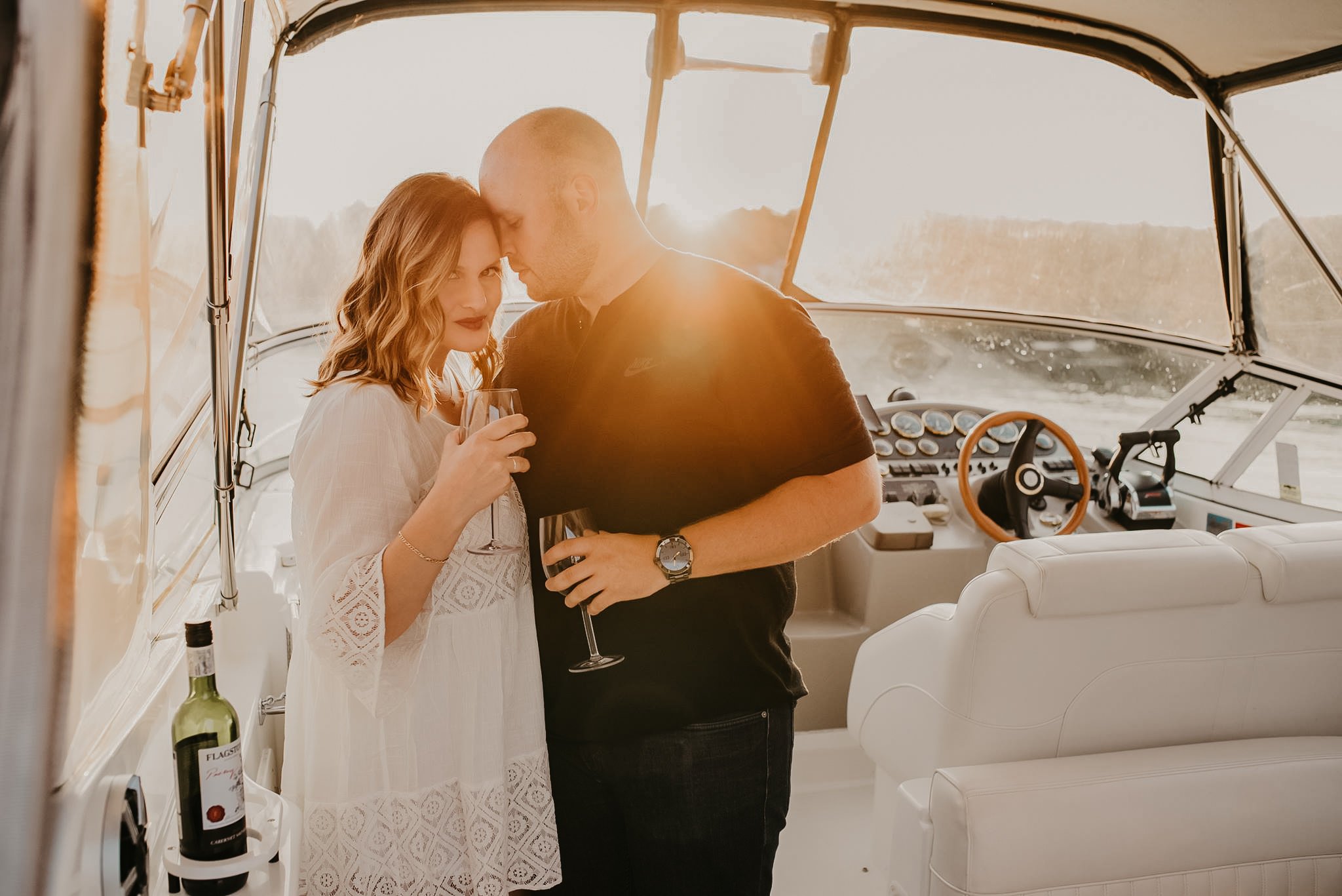 Couple enjoying a golden evening together on a boat